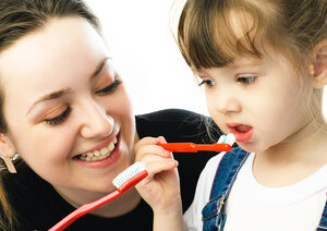 mom and daughter brushing teeth pediatric dentistry Austin, TX